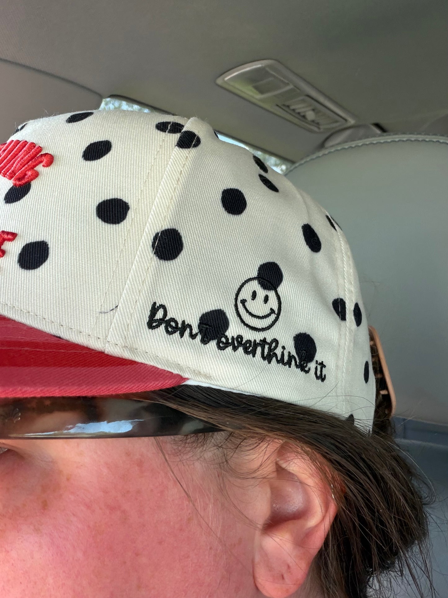 Everything Is Figureoutable Embroidered Trucker Hat | Red & Black Polka Dot Statement Hat