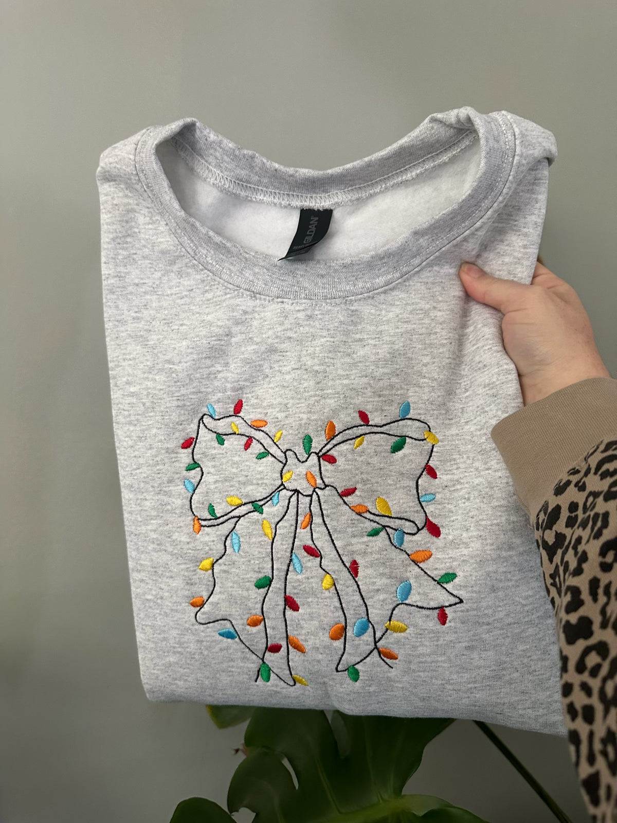 Bow With Christmas Lights Embroidered Crewneck Sweatshirt
